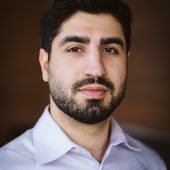 Sam Abazari smiling headshot, co-founder of The Real Housing Experts